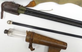 A leather cased belt-attachment hip-flask of long tapering form, 9.5ins long (24cms); together