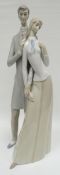 A Lladro model of a standing couple in a sensual pose, 15.5ins high (39cms)