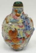 An antique Chinese polychrome relief moulded snuff bottle, red character marks to the oval base, 3.