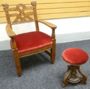 A Welsh Bardic style arm-chair with Celtic carvings and elaborate back, having a pink covered