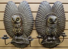 A pair of amusing twin-branch wall-mounted candle sconces in the form of gilded and painted