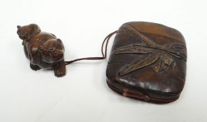 A Meiji period four-section inro carved with dragon-fly in relief and attached by cord to a carved