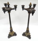 A pair of Continental Classical-style patterned bronze and gilt-bronze candelabra, having three