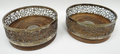 A pair of Elizabeth II part silver wine-coasters to commemorate the Investiture of The Prince of