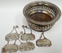 An Elizabeth II wood-lined pierce-work wine-coaster, Birmingham 1976; together with five silver wine