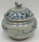 An eighteenth century Chinese blue and white pottery provision jar and cover decorated in the