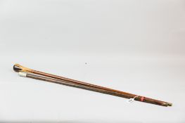 A wooden swagger stick with white metal top bearing the emblem for the Royal Fusiliers along with