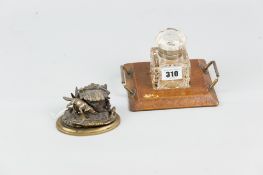 A twin metal-handled oak desk top ink stand with square glass bottle and EP-hinged lid, and a cast