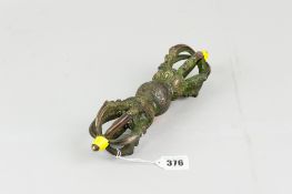 A late nineteenth / early twentieth century cast metal Tibetan Buddhist baja (dorje), six prong