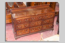 A late 18th/early 19th Century oak and mahogany crossbanded Lancashire chest having a narrow