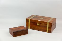 A Victorian walnut and brass bound writing slope, the interior slope with gilt tooled leather