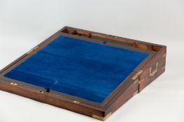A good Victorian rosewood writing slope with brass mounts and inset carrying handles, interior