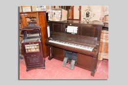 An early 20th Century upright pianola piano manufactured by the Aeolian Company Ltd, London along