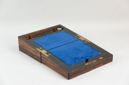 A Victorian rosewood writing slope with brass top plaque and escutcheon, velvet lined writing