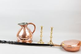 A one gallon copper beer measure. a coper warming pan with patterned handle and turned and