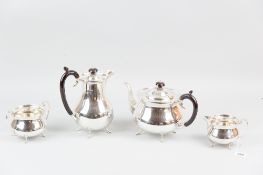 A four piece silver tea and coffee service, each piece of circular plain form and with four shell
