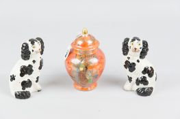 A Wiltonware lustre vase and cover having a mottled orange ground and gilt highlighted Oriental