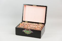 A Victorian ebonized jewellery box having a brass and painted wood inlaid cartouche to the lid