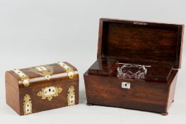 A 19th Century rosewood sarcophagus shaped tea caddy on bun feet, the interior with lift-out