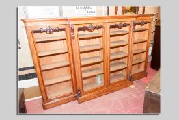 An excellent 19th Century breakfront four door floor standing bookcase with adjustable interior