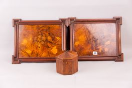 An octagonal rosewood trinket box with a dome topped lid having a ring handle and having an interior