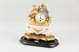 A gilt metal encased mantle clock, the drum dial flanked by a peasant female figurine on an