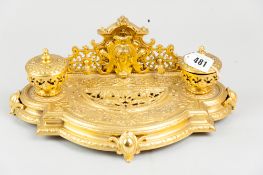 A classical style gilt inkstand, bow fronted and with animal and other scrolled decoration and
