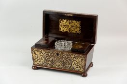 An excellent Regency, rosewood and brass inlaid tea caddy of sarcophagus form raised on turned bun