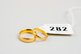 A 22ct wide wedding band, 6.6 gms and a 22ct gold narrow wedding band, 2.7 gms