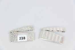 A bright cut silver visiting card case with scrolled decoration, 1.4ozs, Chester 1900 and an