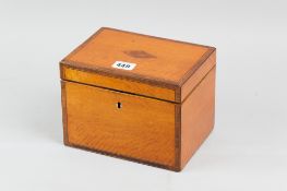 A 19th Century satinwood tea caddy with walnut and boxwood crossbanding, ebonized and boxwood