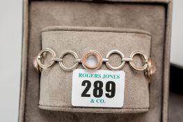 A Clogau gold and quartz mounted circular link silver bracelet, 17.4 gms gross