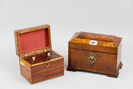 A Victorian walnut tea caddy with pierced decorative escutcheon, twin lidded interiors with brass