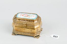 A late nineteenth century French gilt metal casket surmounted with a hand painted Sevres style