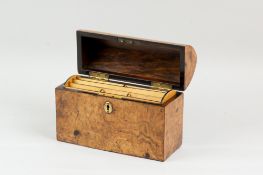 A Gothic arched lid walnut stationery box, the lid opening to reveal a satinwood and ebonized