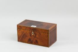 A Georgian mahogany tea caddy with ivory diamond shaped escutcheon and ebony and boxwood edge