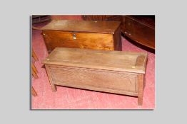 A long wooden carpenter's chest with interior box end drawer, 109 cms wide and another narrow