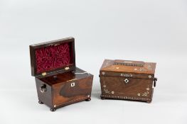 A Victorian rosewood and mother of pearl inlaid sarcophagus shaped tea caddy with carved wooden ring