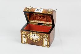 A Victorian walnut dome topped jewellery casket with chased brass embellishments and overlaid bone