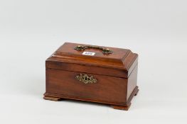A Georgian mahogany three division tea caddy with brass carrying handle and escutcheon on bracket