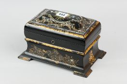 A 19th Century papier mache tea caddy of sarcophagus form with mother of pearl and abalone inlay,