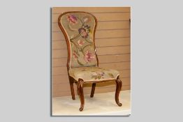 A Victorian mahogany narrow spoonbacked armless chair on cabriole and knurl front supports and