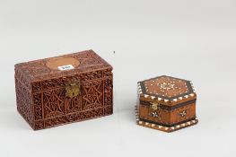 An anglo-Indian octagonal lidded box with multi-wood and bone inlay and a heavily-carved Eastern