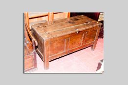 An 18th Century oak dower chest having three inset panels to the front, 130 cms wide