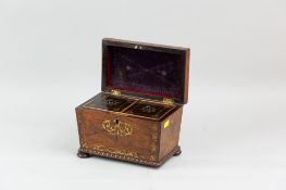A 19th Century rosewood and brass inlaid tea caddy of sarcophagus form with bead moulded base on