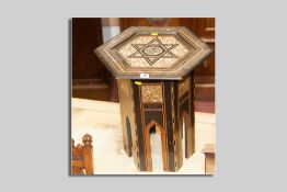 An Eastern style hexagonal topped side table with multi-wood Tunbridge type inlay, ebonized woods