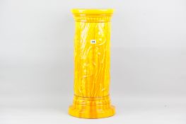 A Burmantofts yellow glazed jardiniere pedestal of cylindrical form with raised flowers  to a wide