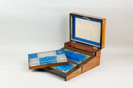 A Victorian figured walnut combination jewellery box and writing slope, re-lined satin interior