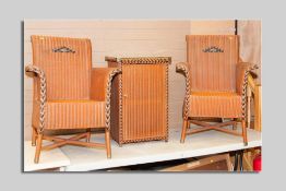 A pair of Lloyd loom orange coloured armchairs with black flashing by W Lusty & Sons and a