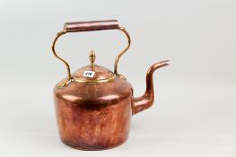 A Georgian copper kettle with acorn knob
